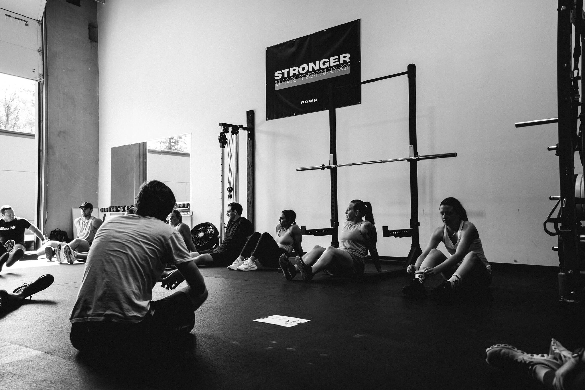 POWR members strength training with a coach