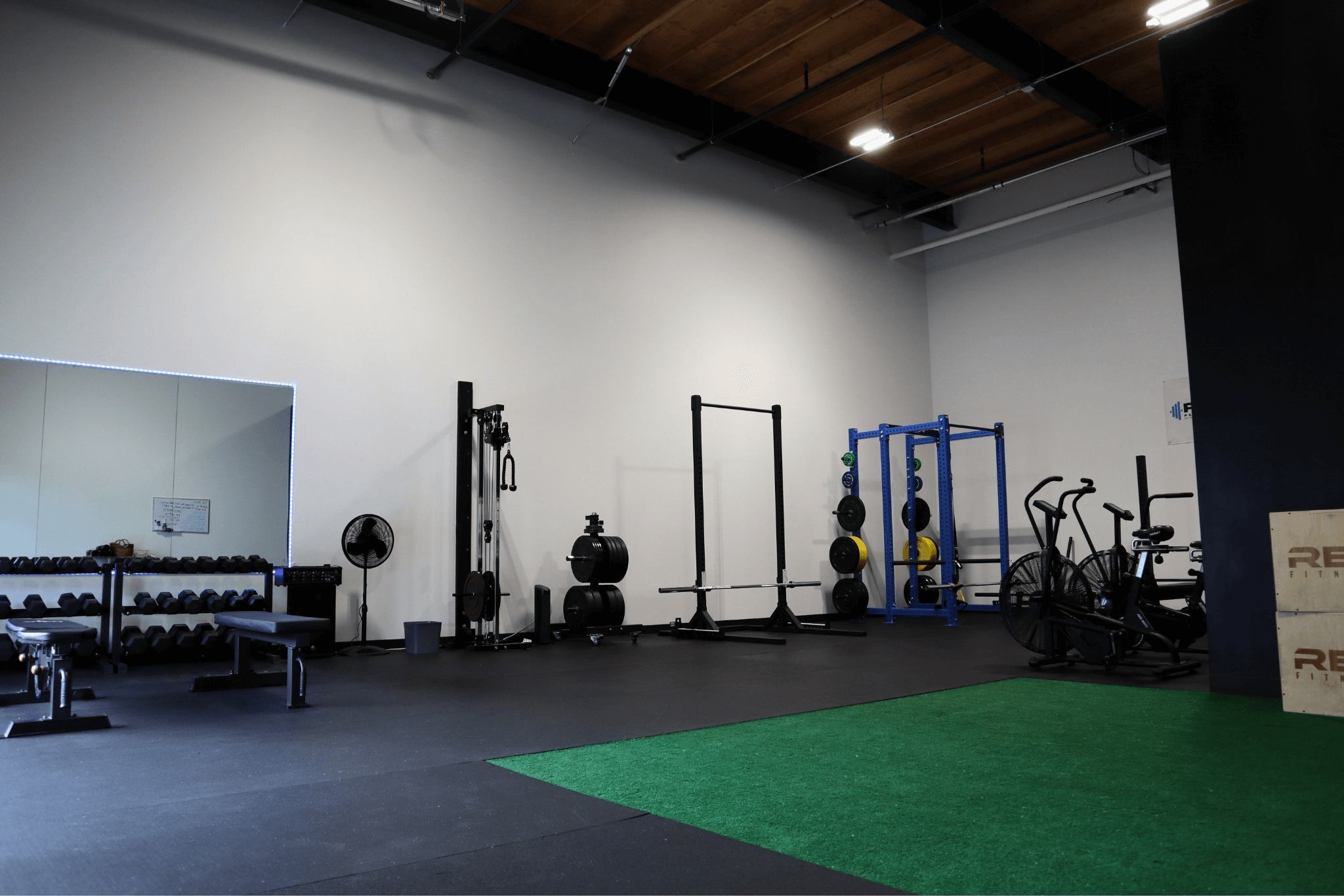 POWR studio turf lane with sleds and conditioning equipment
