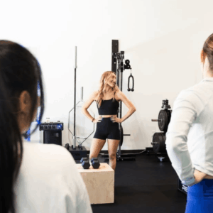 A POWR coach talking a small group through a training session